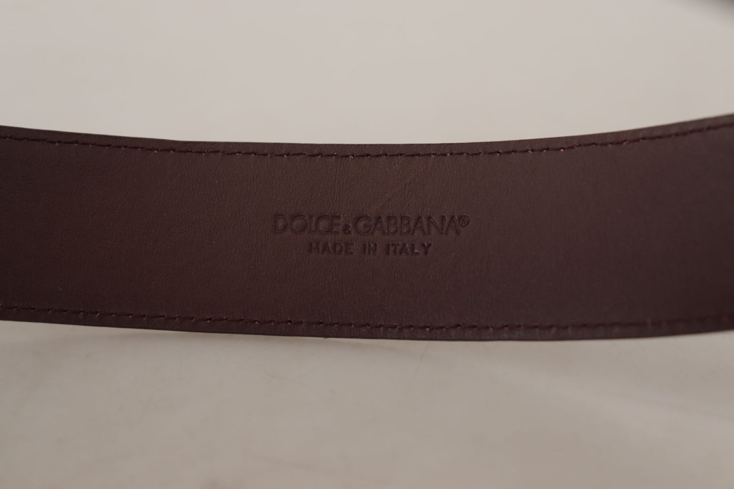 Dolce &amp; Gabbana Elegant Maroon Leather Belt with Engraved Buckle